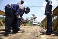 Road Worker fixing a bridge on road