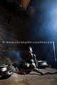 Enfant Somba (Ethnie Otamari) dans une pièce de son habitation le "Tata", case familiale fortifiée traditionnelle. Nord Bénin. Africa 
 Afrique 
 Attacora 
 Benin 
 Bénin 
 Somba 