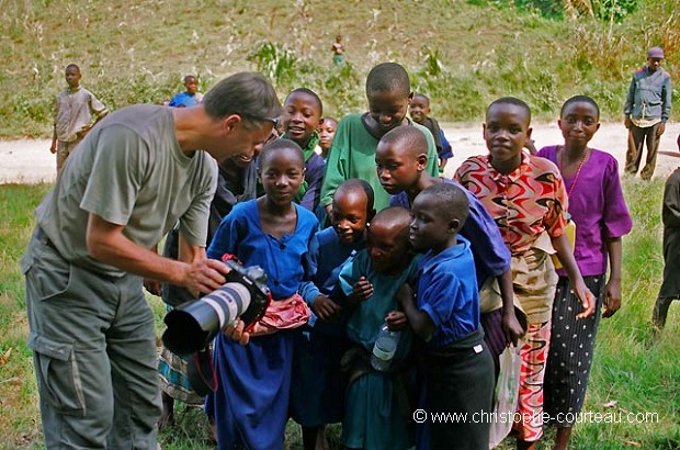 Christophe Courteau in Rwanda, taking photographs of children